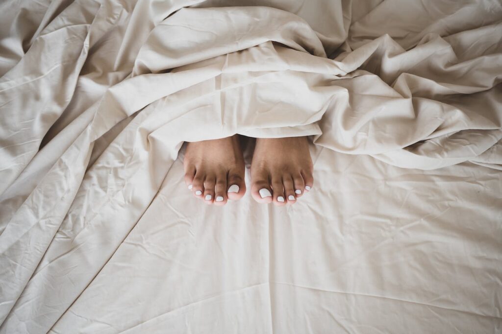 Is It Better to Sleep Without Socks: Tips for Comfortable Sleep without Socks